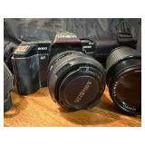 Vintage Minolta Maxxum 5000, which is a 35mm single-lens reflex (SLR) film camera Plus extra lens and case