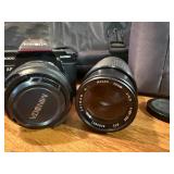 Vintage Minolta Maxxum 5000, which is a 35mm single-lens reflex (SLR) film camera Plus extra lens and case