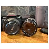 Vintage Minolta Maxxum 5000, which is a 35mm single-lens reflex (SLR) film camera Plus extra lens and case