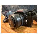 Vintage Minolta Maxxum 5000, which is a 35mm single-lens reflex (SLR) film camera Plus extra lens and case