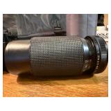 Vintage Minolta Maxxum 5000, which is a 35mm single-lens reflex (SLR) film camera Plus extra lens and case