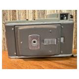 This item is a vintage Polaroid Land Camera, specifically identified as a Model 80 Highlander from the 1950s