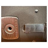 This item is a vintage Polaroid Land Camera, specifically identified as a Model 80 Highlander from the 1950s