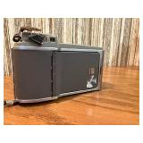 This item is a vintage Polaroid Land Camera, specifically identified as a Model 80 Highlander from the 1950s