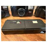 Vintage film cameras, including models from Vivitar, Nikon, and Canon.