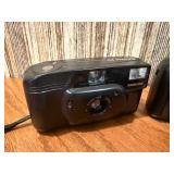 Vintage film cameras, including models from Vivitar, Nikon, and Canon.