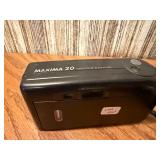 Vintage film cameras, including models from Vivitar, Nikon, and Canon.