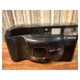 Vintage film cameras, including models from Vivitar, Nikon, and Canon.