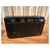 Vintage film cameras, including models from Vivitar, Nikon, and Canon.