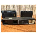 Vintage film cameras, including models from Vivitar, Nikon, and Canon.