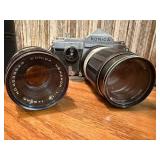 vintage Konica 35mm SLR film camera with multiple lenses