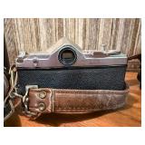 vintage Konica 35mm SLR film camera with multiple lenses