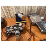 The image displays a collection of vintage cameras and photography accessories, look close at these gems !
