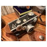 The image displays a collection of vintage cameras and photography accessories, look close at these gems !