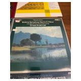 English -9 classical music vinyl LP records. These albums include recordings of composers such as Mozart, Brahms, and Strauss. This lot is listed in Near Mint to Mint condition.