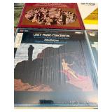 English -9 classical music vinyl LP records. These albums include recordings of composers such as Mozart, Brahms, and Strauss. This lot is listed in Near Mint to Mint condition.