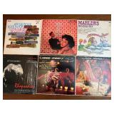 This collection of vintage RCA Victor vinyl records features classical music and big band performances from the mid-20th century.
