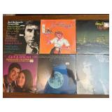 Unopened -collection of vintage vinyl records featuring artists like Burt Bacharach, Lawrence Welk, and Bert Kaempfert.