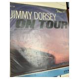 Vintage big band and jazz LP collection featuring well-known artists including Glenn Miller, Jimmy Dorsey, Buddy Morrow, and Tommy Dorsey, along with multiple “Big Band Hits of the 30s”