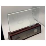 2003 Playoff Absolute Memorabilia Torii Hunter Glass Display With a Piece of his Game-Worn Jersey Authenticated and Serial #'d 074/150, the Glass Display Has a White Etching of Torii Hunter