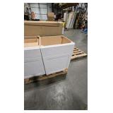 pallet of white cabinets