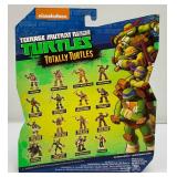 Misc. Collectible TMNT Items Including Miniature Keychains, Action Figure And More (All New Old Stock)
