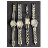 LL - Four Silver-Tone Women