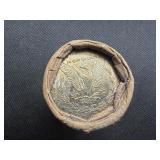 Unopened 20 coin roll of Morgan silver dollars with a high grade 1893 at one end and a high grade CC at the other end