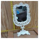vintage Victorian-style cast iron vanity mirror