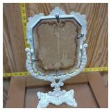 vintage Victorian-style cast iron vanity mirror