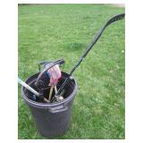 Rubbermaid trash can containing hoc...