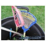 Rubbermaid trash can containing hoc...