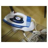 Oreck steam iron with storage holde...