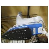 Oreck steam iron with storage holde...