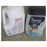 Full and partial jugs of ice melt...