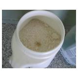 Full and partial jugs of ice melt...
