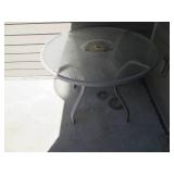 Round metal famed glass top patio t...