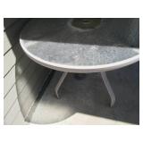 Round metal famed glass top patio t...