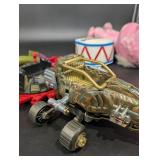 EnerGizer Round Container with Plush Bunny and Vehicle Parts - Mixed Toy Collection