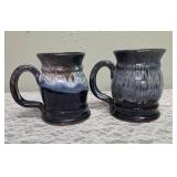 Two handmade stoneware mugs commonly sold as souvenirs at Renaissance Festivals.  Produced by Deneen Pottery.