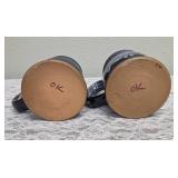 Two handmade stoneware mugs commonly sold as souvenirs at Renaissance Festivals.  Produced by Deneen Pottery.