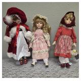 Three collectible porcelain dolls.  From the Premier Doll collection.