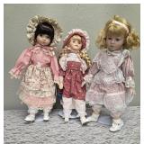 Three collectible porcelain dolls.  From the Premier Doll collection.