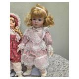 Three collectible porcelain dolls.  From the Premier Doll collection.