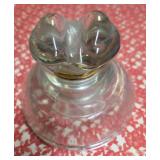 Vintage Clear glass power insulator, commonly called a "Ink Well", "Frog Eye" or "Saddle Style" and  used on telephone or telegraph poles to hold wires while preventing electricity from grounding.