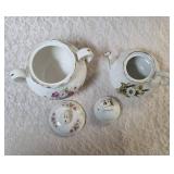 Vintage Sugar and Vintage Teapot.   The Teapot is marked on the bottom as genuine ironstone from the Ellgrive collection and the sugar bowl is Royal Firenza China.