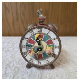 Vintage, hand painted resin musical clock with spinning hands featuring animated twirling mice, often sold as a decorative collectible or music box.  Check out you-tube video in photos.