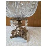Vintage cut crystal pedestal centerpiece bowl for fruit/candy. Features a decorative metal stand with dangling prisms. Often categorized as Hollywood Regency or 19th Century style. Approx. 10" tall.