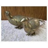 Two vintage brass pheasant figurines. Figurines are solid brass with a polished or natural patina finish and are considered mid-century modern, featuring etched feather detailing.  Approx. 15" long.  