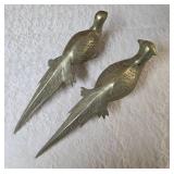 Two vintage brass pheasant figurines. Figurines are solid brass with a polished or natural patina finish and are considered mid-century modern, featuring etched feather detailing.  Approx. 15" long.  